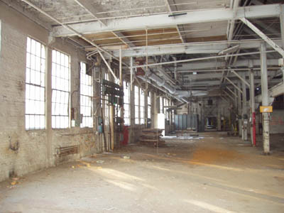 Entering Mill C in the back, one finds this room which appears to be either a shipping/receiving area or possibly some sort of machining room, or maybe both.